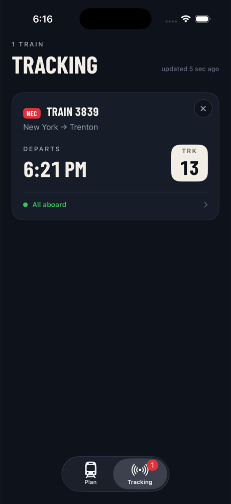 The Tracking tab showing a card for train 3839, New York to Trenton, departing 6:15 PM from track 13, status All aboard.